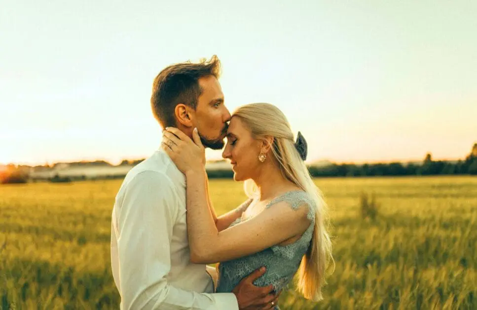 Man kissing his partner on the forehead. Online Counselling Australia. Brisbane Livewell Clinic. Couples Therapy. Relationship Therapy