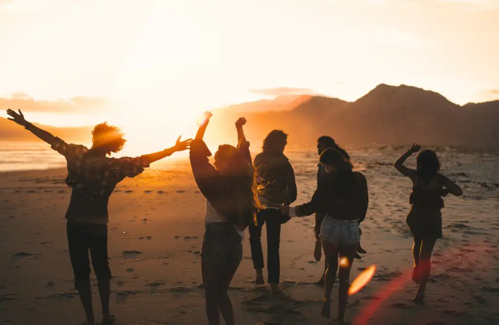 Friends dancing on the beach at sunset. Hypnosis Wavell Heights. Probiotics for Thrush. Holistic Counselling Wavell Heights. Hypnosis for Anxiety. Brisbane Livewell Clinic