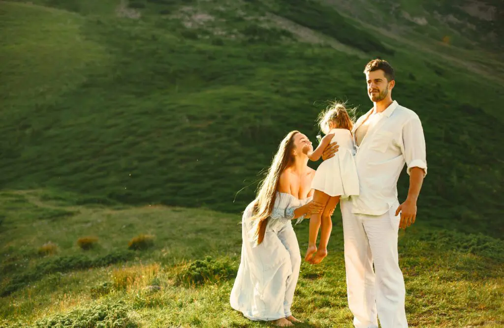 Family carrying their daughter in the mountains. Counselling Chermside. Family Counselling. Brisbane Livewell Clinic