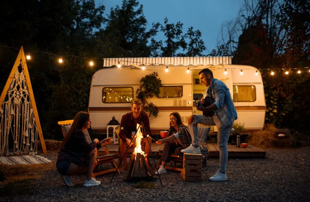 Friends gather around a campfire, enjoying warmth and laughter. Bowen Theory. Hypnotherapy for Alcohol Addiction. Brisbane Livewell Clinic