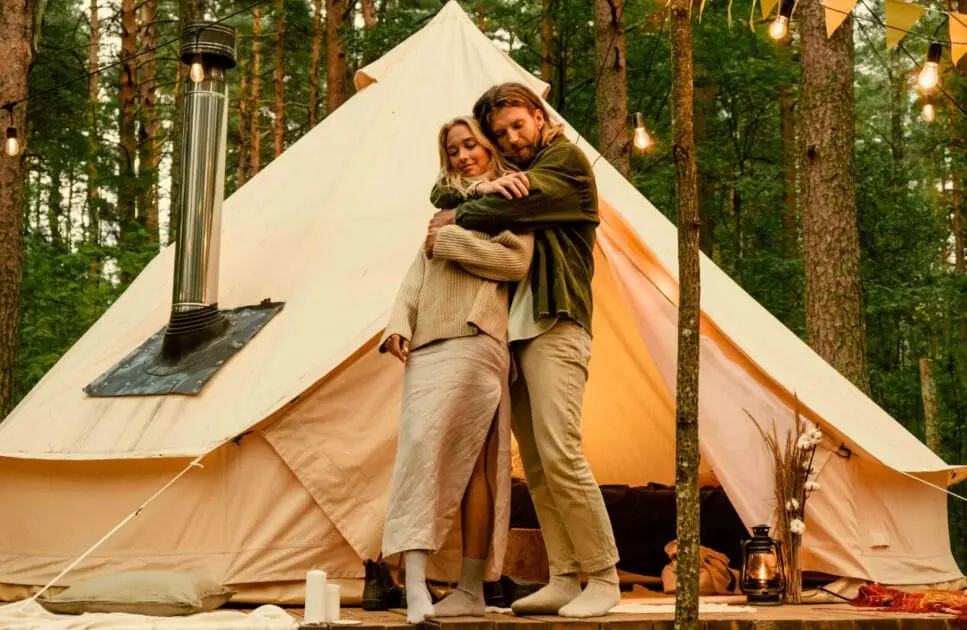 Couple hugging near a white tent. Couples Counselling. Hypnosis for Anxiety. Brisbane Livewell Clinic