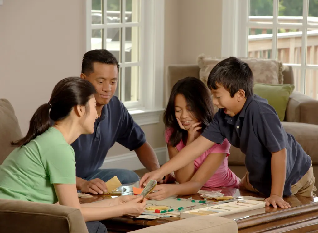 Family playing a board game. Jeremy Walker - Hypnotherapist Brisbane